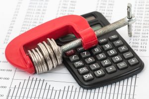 Bayou La Batre Debt Relief Program Canva Coins and Calculator on a Invoice 2 300x200